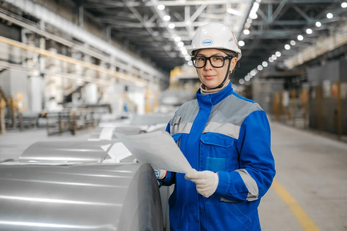 A buyer examining a manufactured component